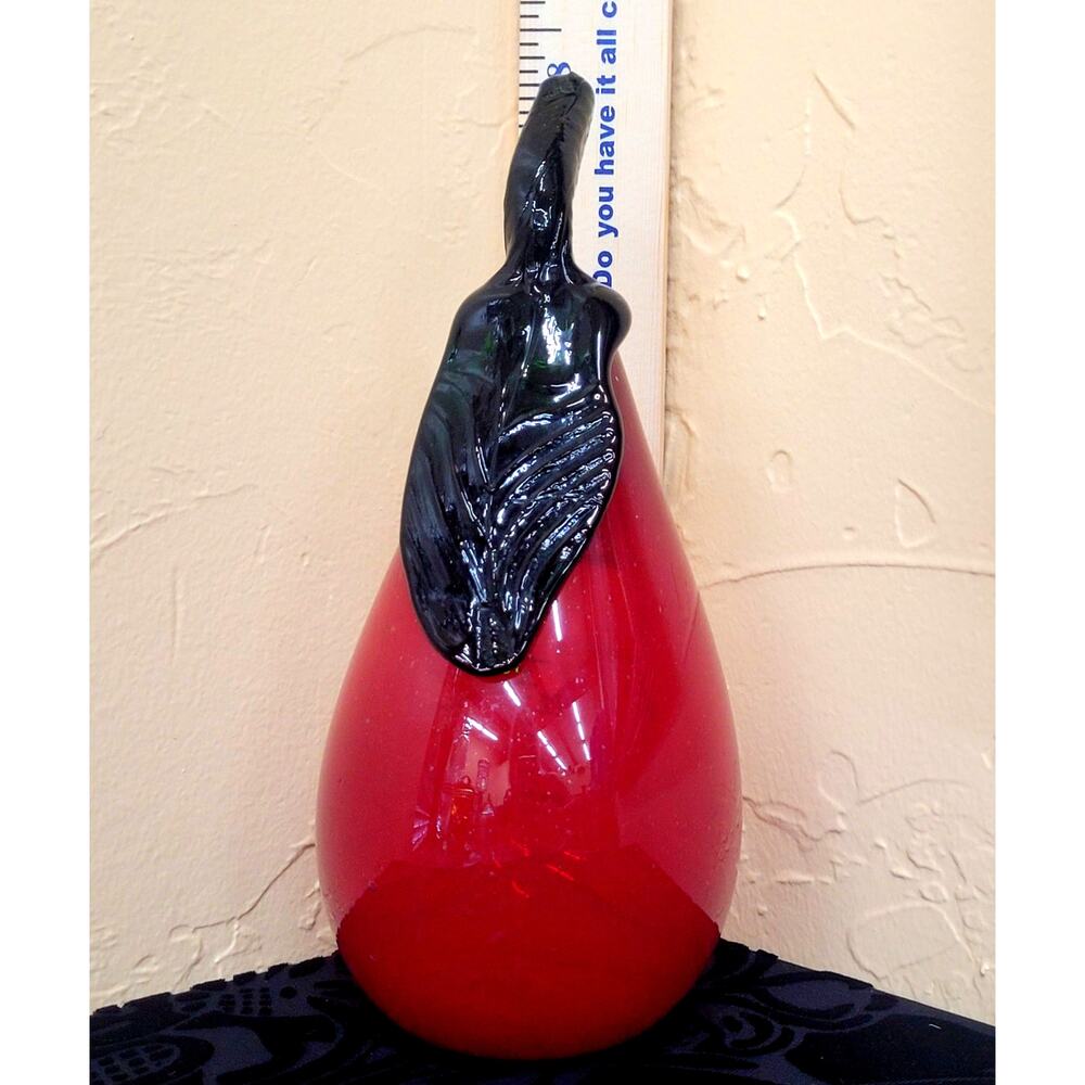 A Hand Blown Red Pear with Green Stem. This is 8 1/4" Tall